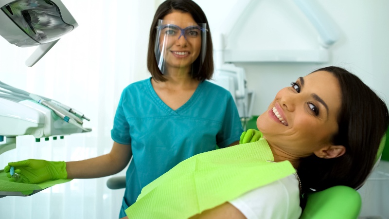 Smiling patient after gum treatment in Trenton, MI