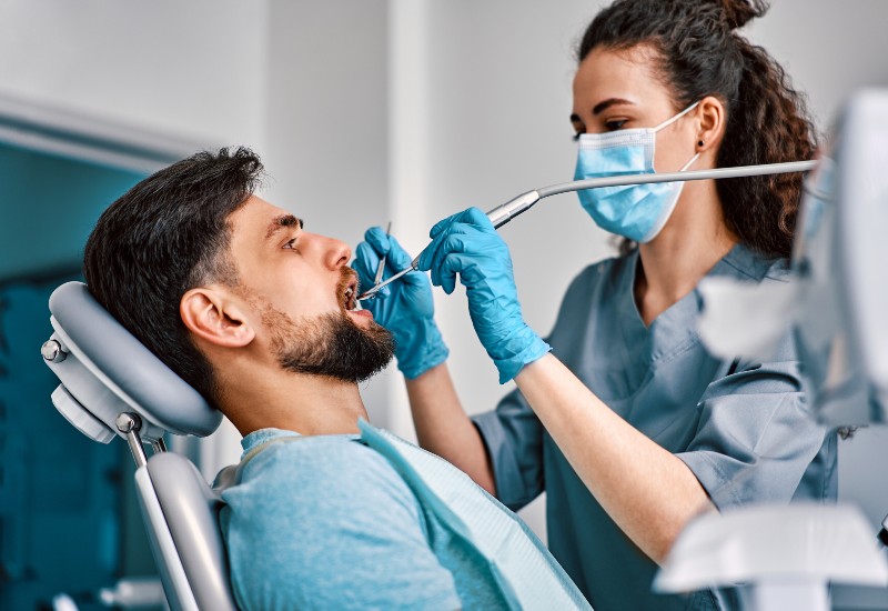 Patient undergoing dental care procedure in Trenton, MI